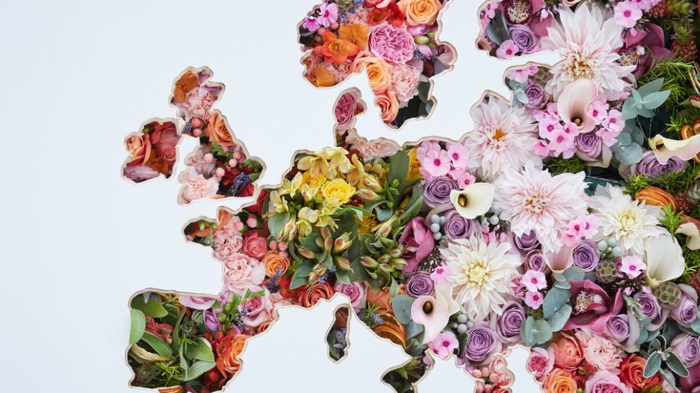 A giant floral map of the world is unveiled at London Heathrow Airport.