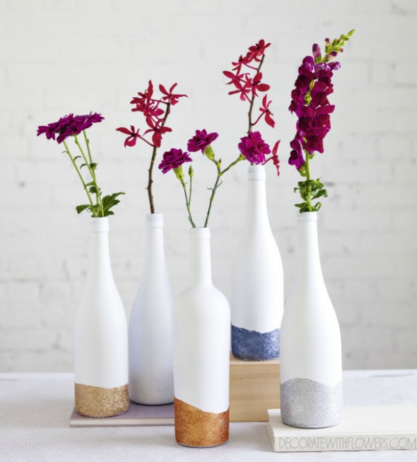 painted bottles as vases with sparkles
